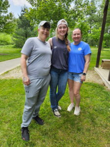participants in the high ropes course sober social outing posing for a photo